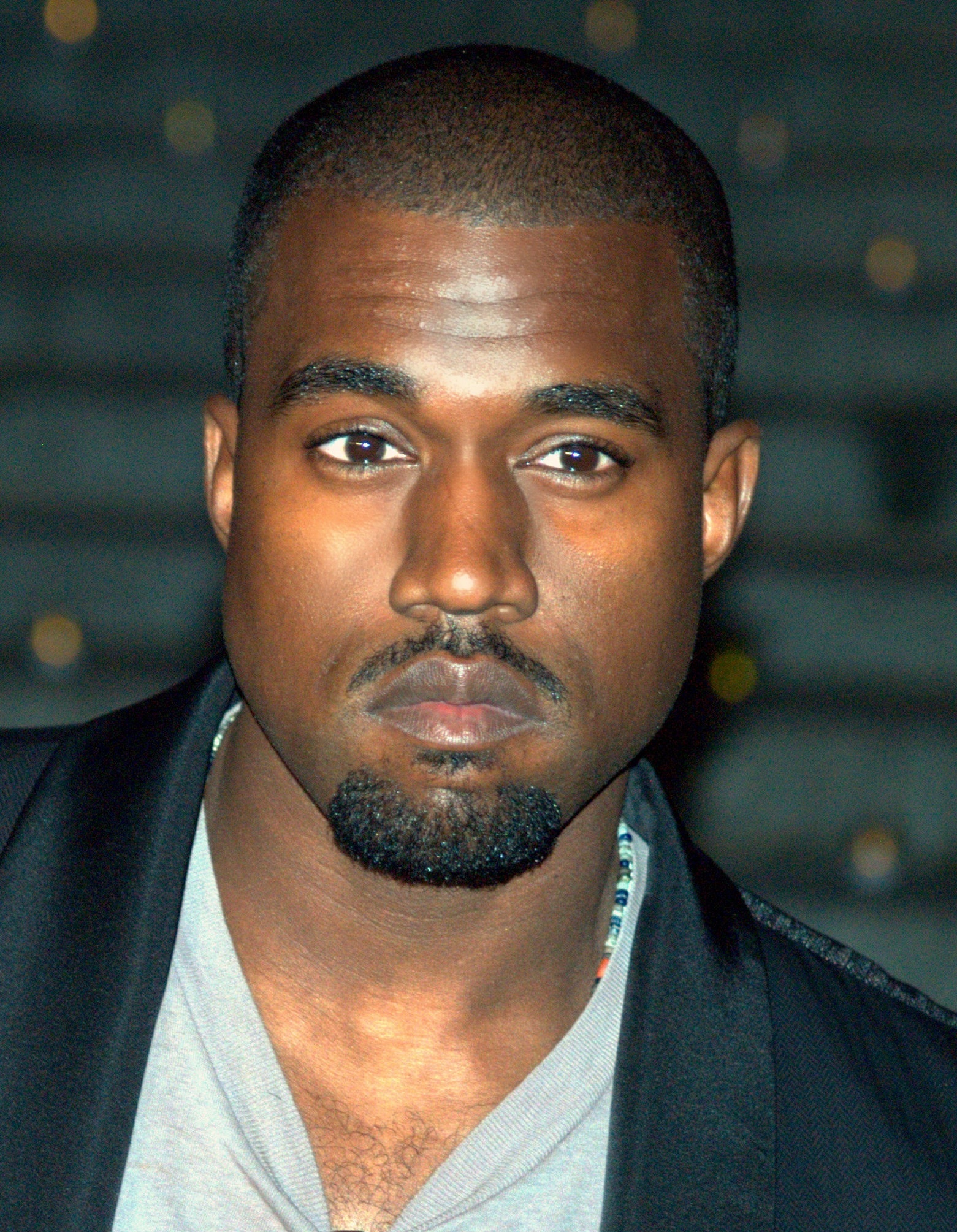 Kanye West at the 2009 Tribeca Film Festival||Kanye West and Kim Kardashian