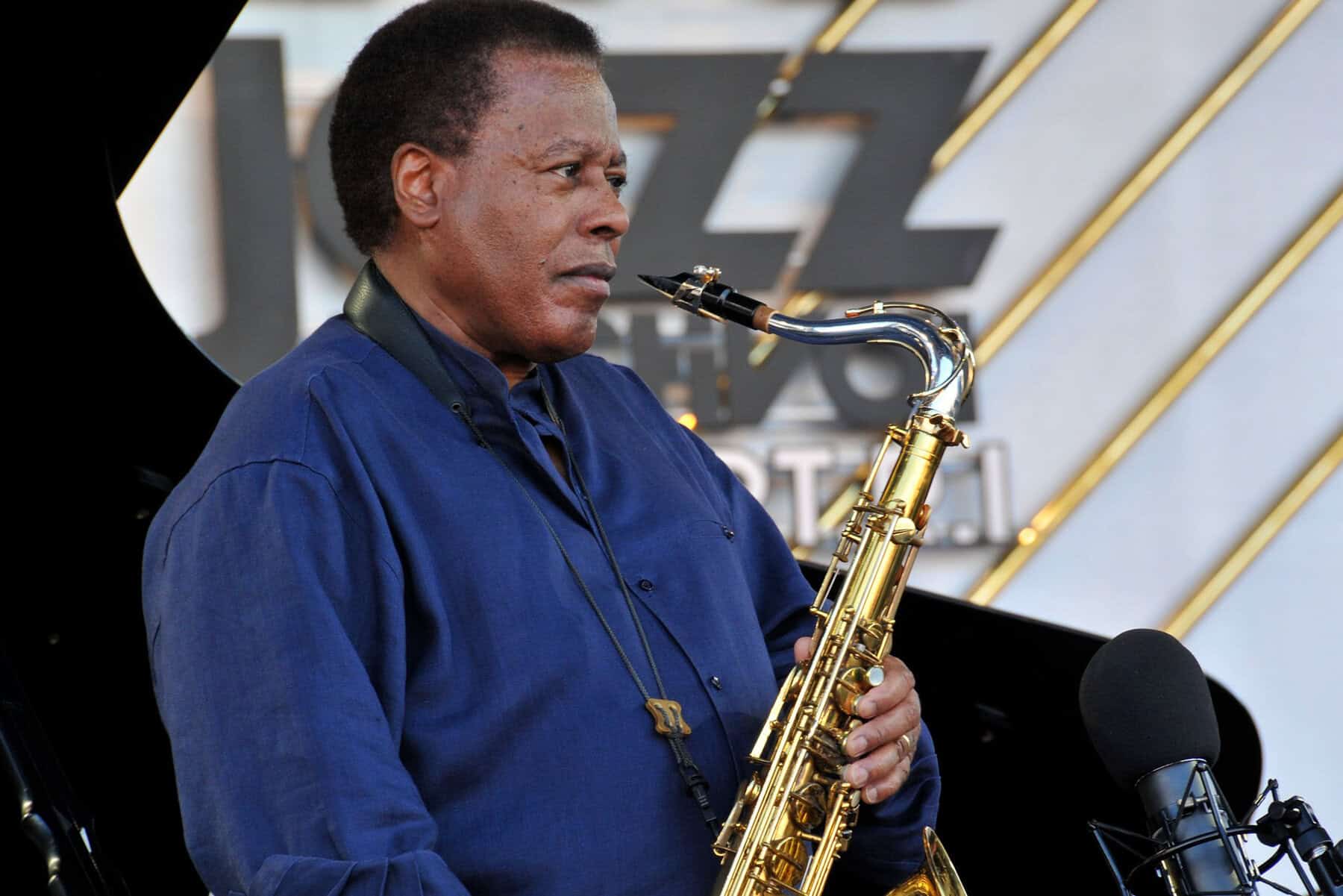 04182023_71860_01|04182023_71860_02 Shorter holding saxophone|