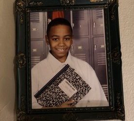 Portrait of Deion Fludd at his mother's home|Deion Flood Kissed by His Girlfriend