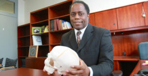 Mark Johnson Holding Skull (UMass Medical School)