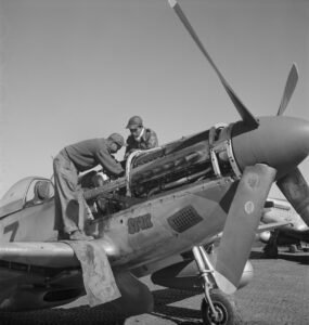 Mechanic Marcellus Smith and Pilot Roscoe C. Brown Working on P-51 Mustang (Courtesy of Alamy Images).