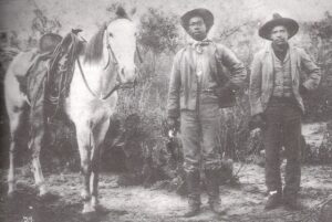 Unidentified Cowboy and Vaquero, Grande Area, ca. 1900 (Institute of Texan Cultures)