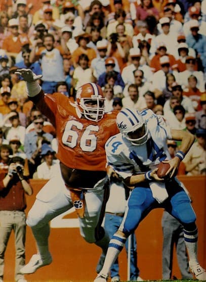 Football player William "the Refrigerator" Perry sacks Duke quarterback Ben Bennett