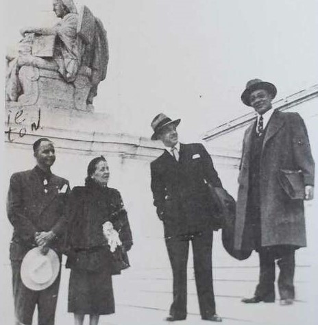 Melton, Fleming, Smith and Nabritt on Steps of US Supreme Court Building with statue of seated figure in the background